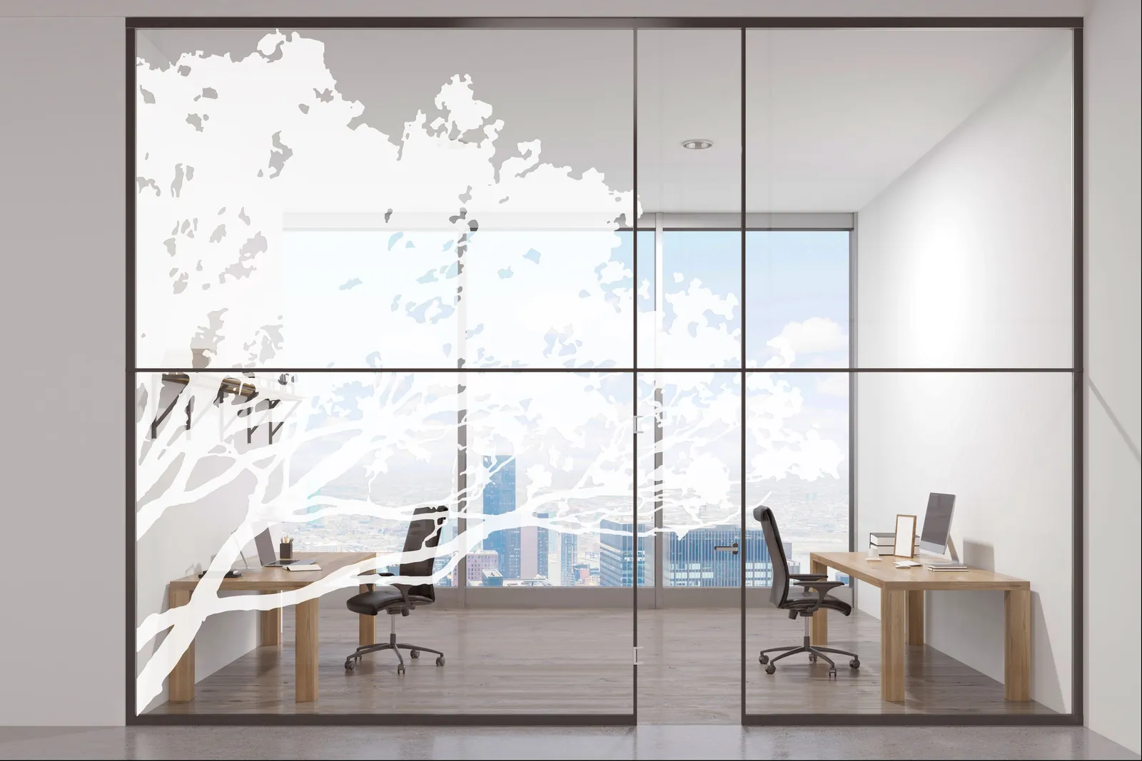 Simulation : bureau vitré dont les baies sont couvertes de branches d’arbre en silhouette blanche